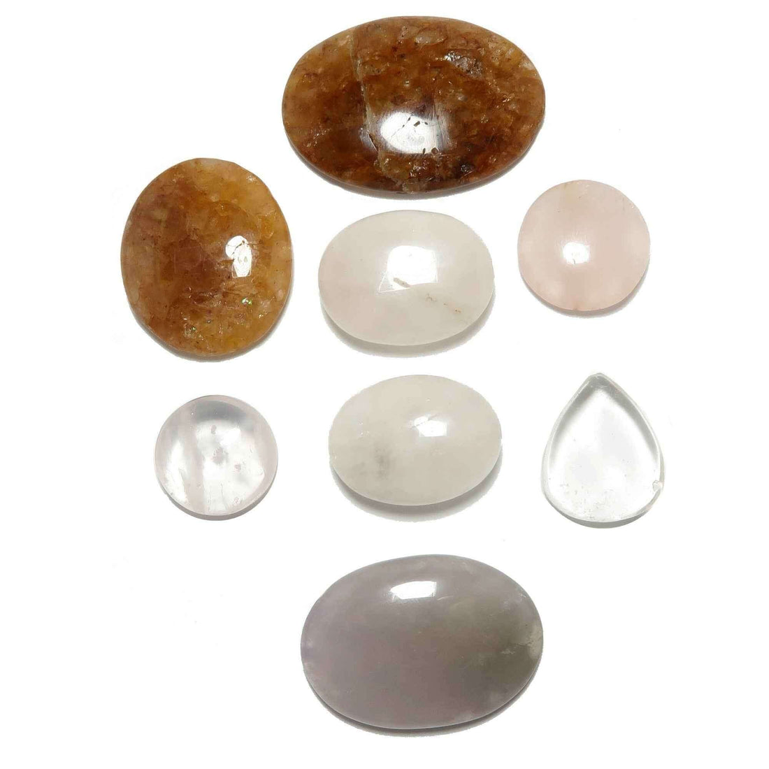 Collection of healing crystals including clear quartz, amethyst, rose quartz, and citrine for spiritual beginners