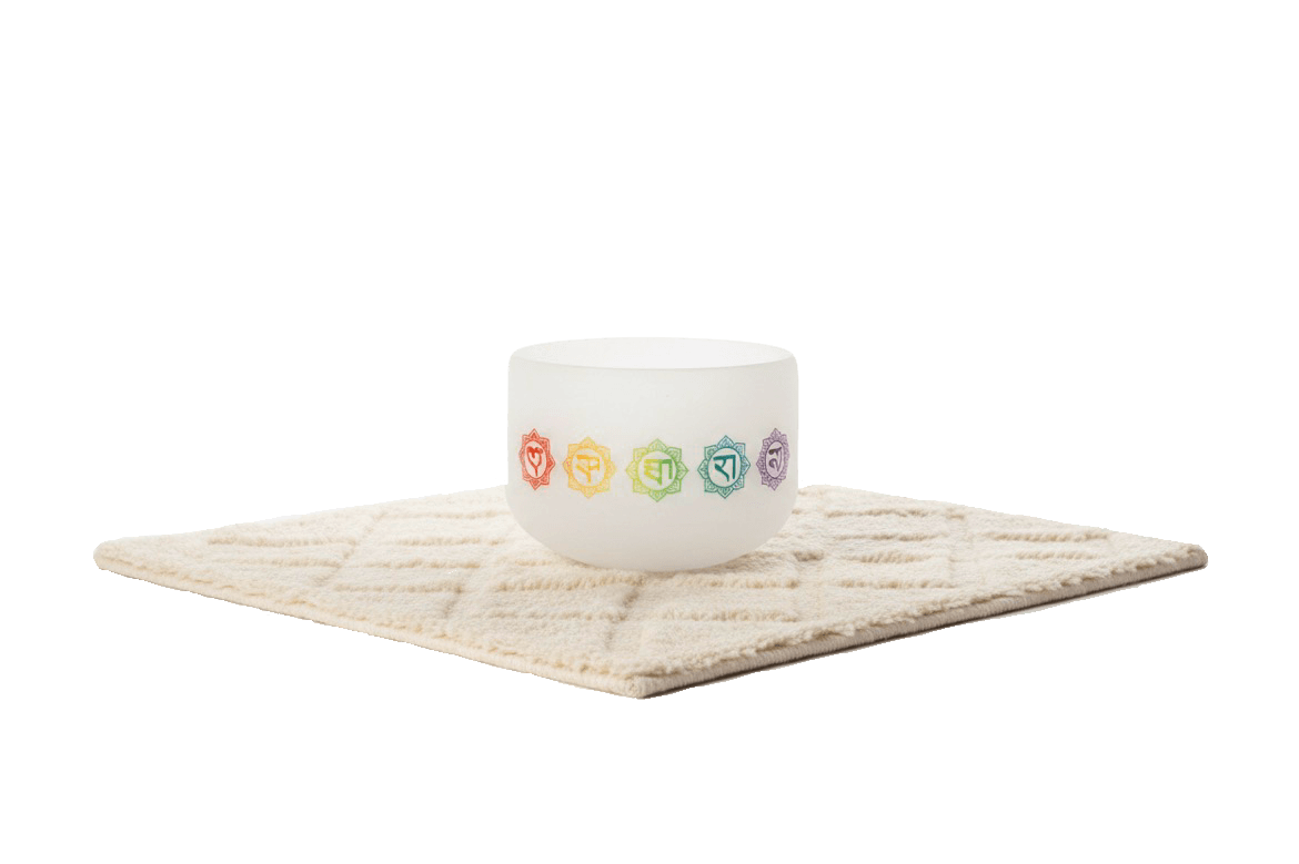 White chakra crystal sound healing bowls for meditation placed on soft beige mat