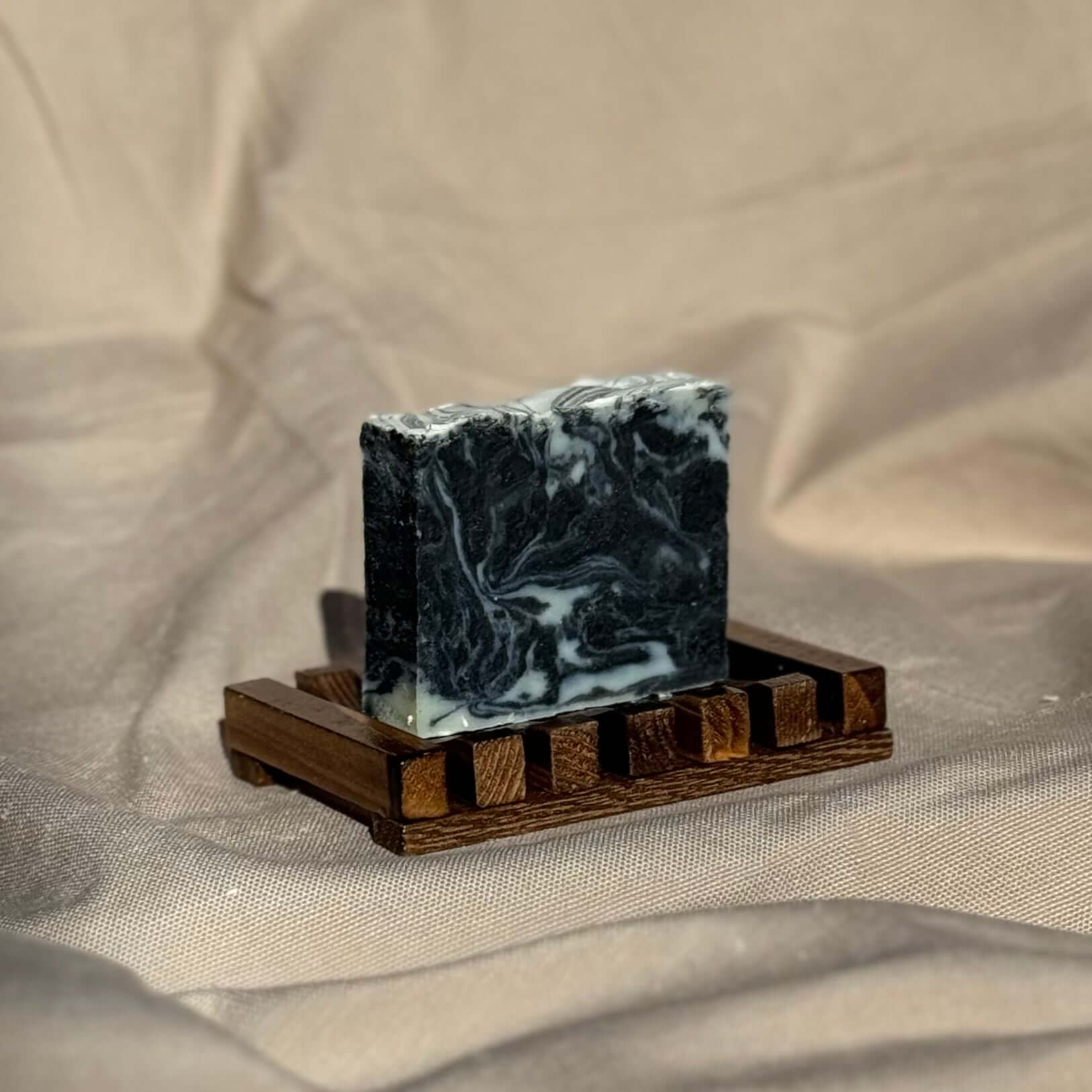 Classic Lavender Soap Bar with activated charcoal on wooden soap dish, handmade moisturizing natural lavender essential oil soap