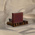 Cedar Wood & Frankincense Soap Bar with french red clay on wooden soap dish for balanced, irritated and acne-prone skin