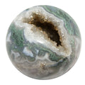 Moss Agate sphere with green jungle cave geode opening, polished crystal ball for meditation and spiritual wisdom