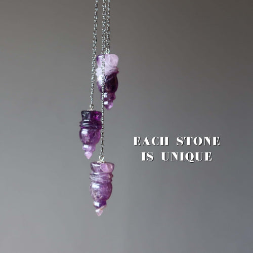 Amethyst pendulum for dowsing featuring three carved purple crystal points on chains, each stone is unique