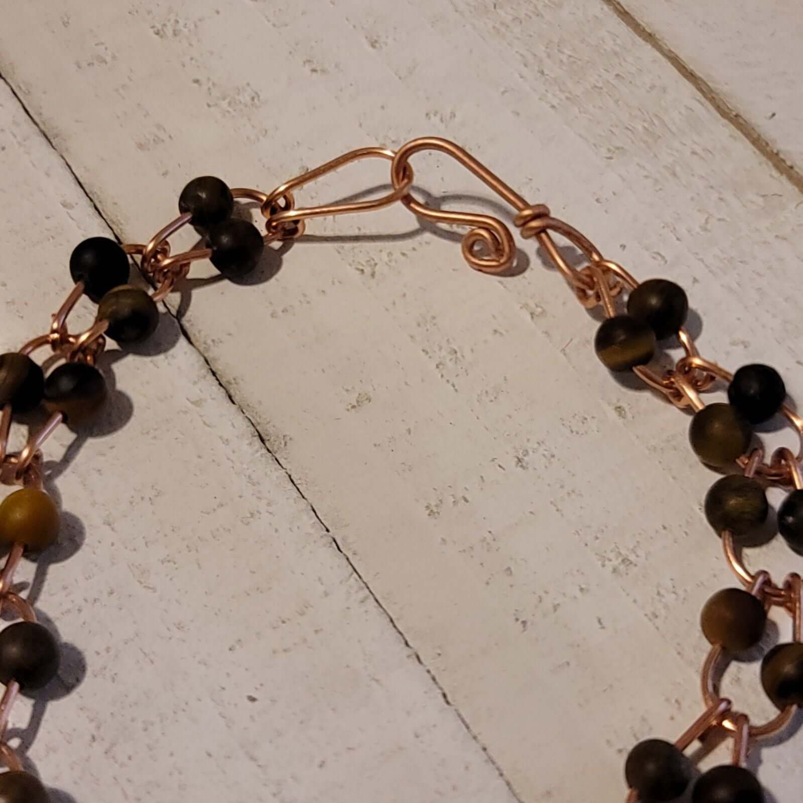 Bracelet à maillons en fer à cheval en cuivre fait main avec perles œil de tigre