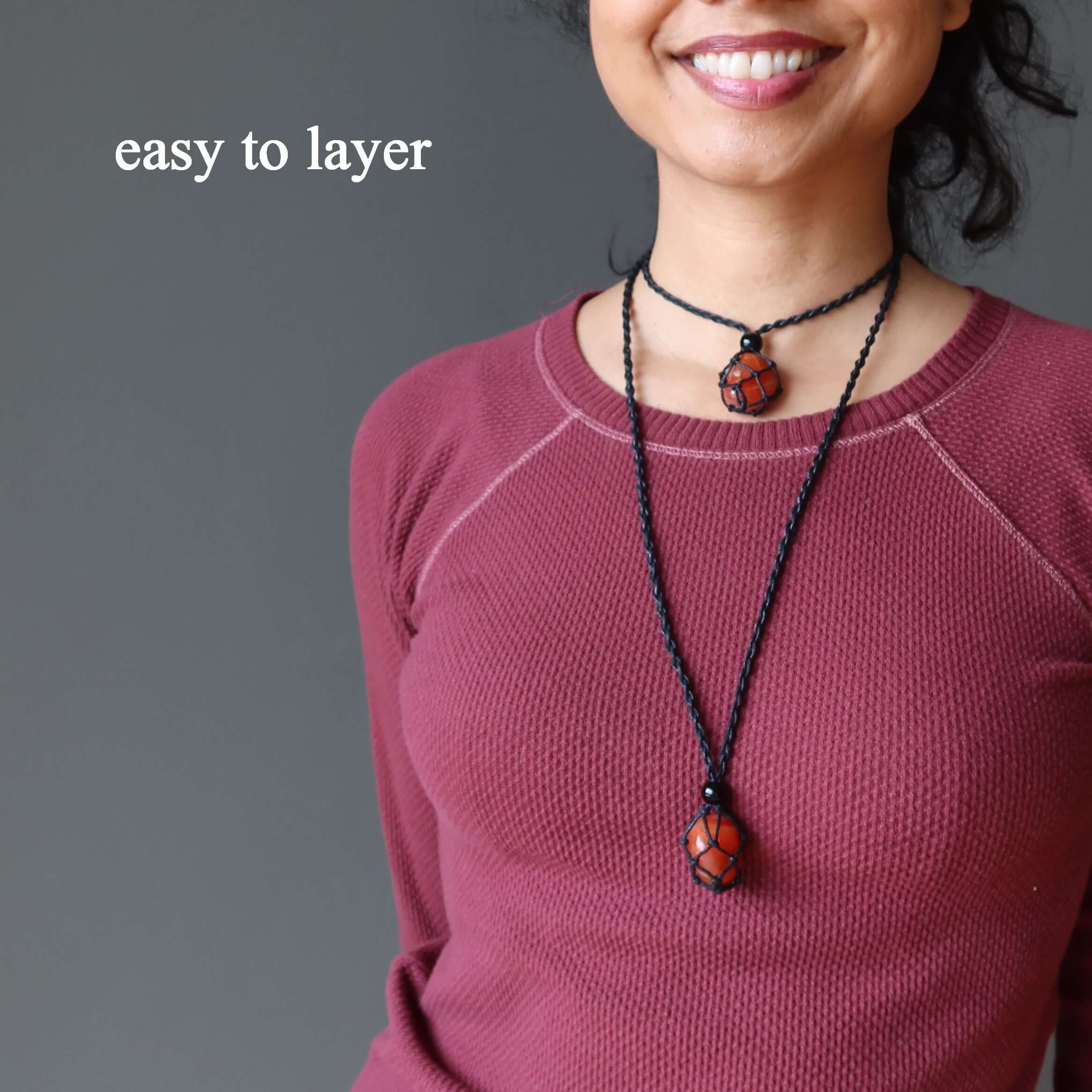 Layered Carnelian macrame necklace with orange crystal stone pendant on adjustable black cord