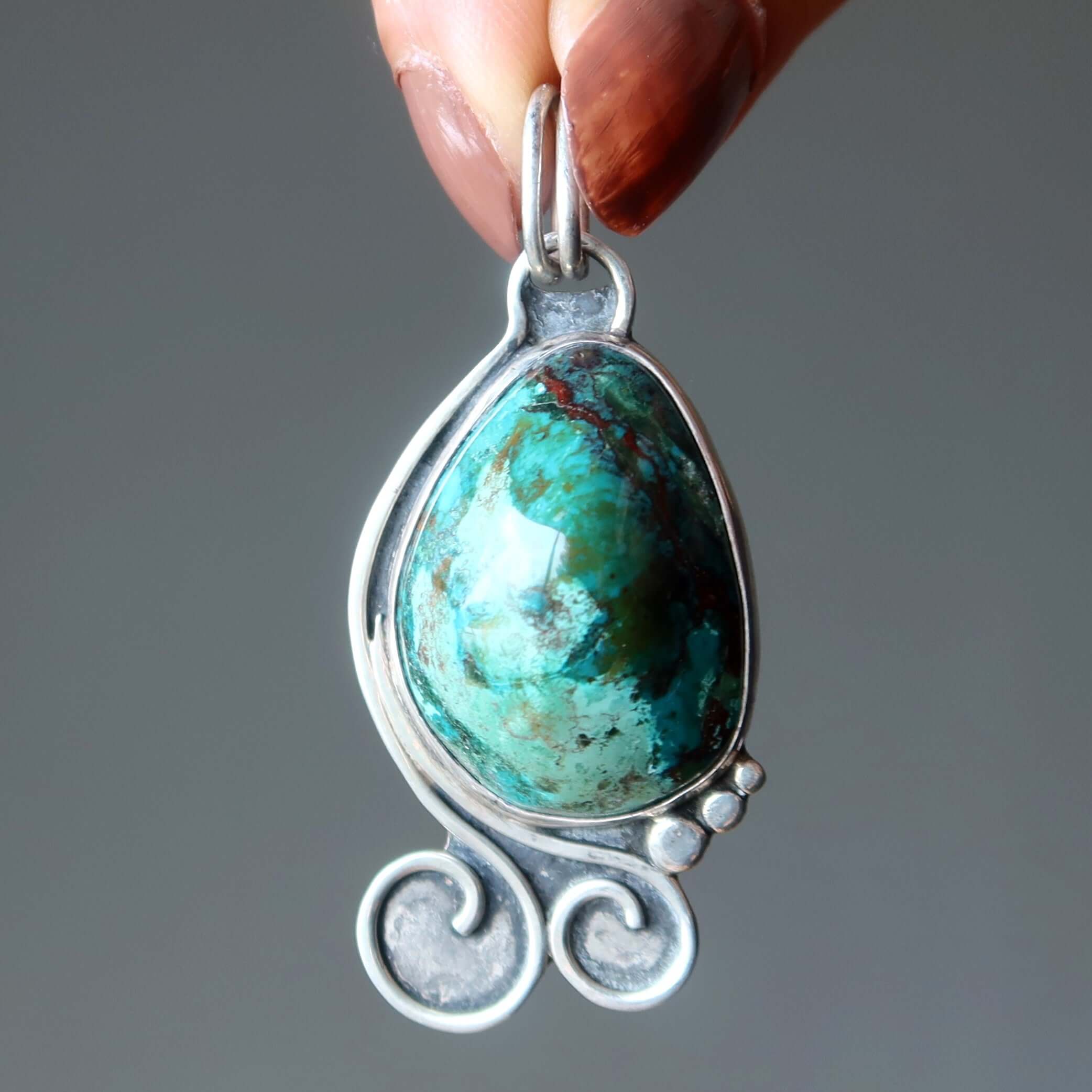 Chrysocolla pendant cuprite Sonora gem set in sterling silver with swirling artisan bezel design