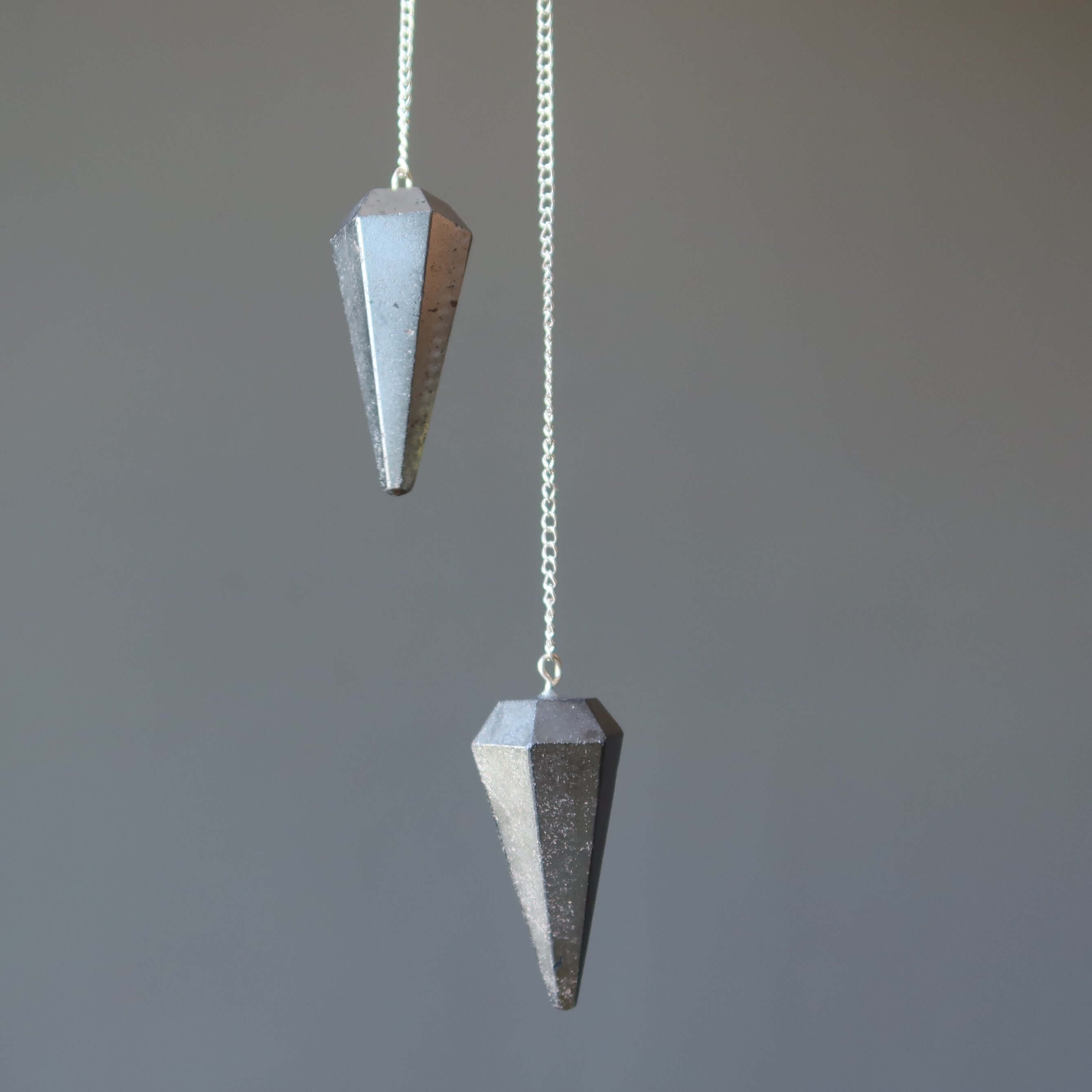 Hematite Pendulum Open Mind Dowsing Stone of Truth crystal for divination and healing, faceted silver pendulums on chains