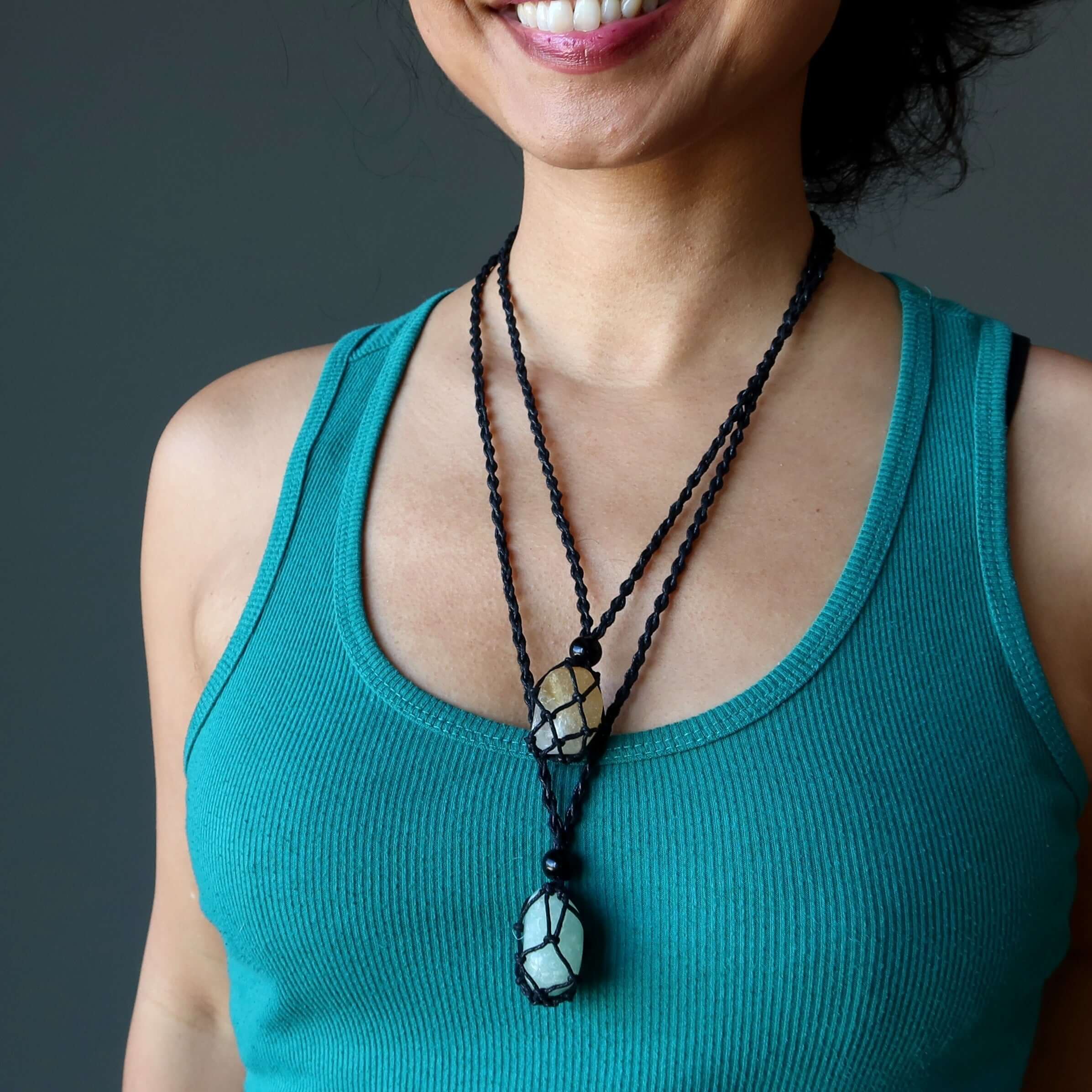 Money Necklace Set with citrine and green aventurine stones in black macrame on woman wearing teal tank top