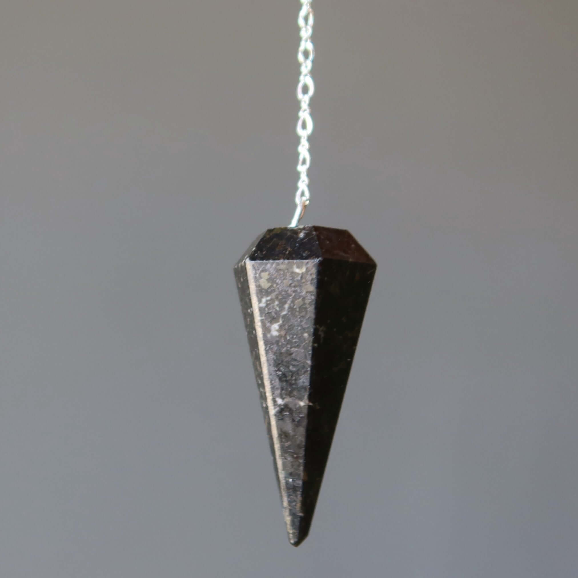 Nuummite Pendulum Mysteries Sterling Silver crystal Pendulum for dowsing, healing, and chakra assessment