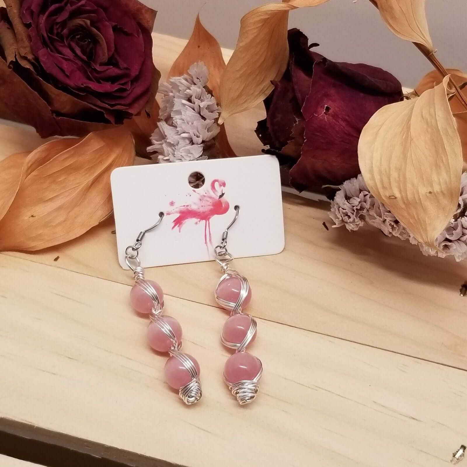 Handmade Pink Cat’s Eye Bead Earrings – Wire Wrapped Dangle Jewelry displayed on card with silver-tone hooks