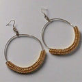 Handmade Gold Spring Hoop Earrings – Lightweight Wire Wrapped Hoops with silver-tone base and gold coil detail on a gray background