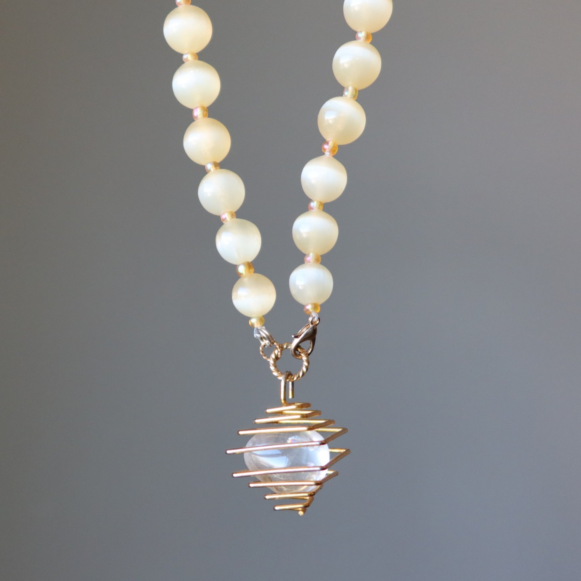 Selenite Necklace Warm Orange Beads with Caged Quartz