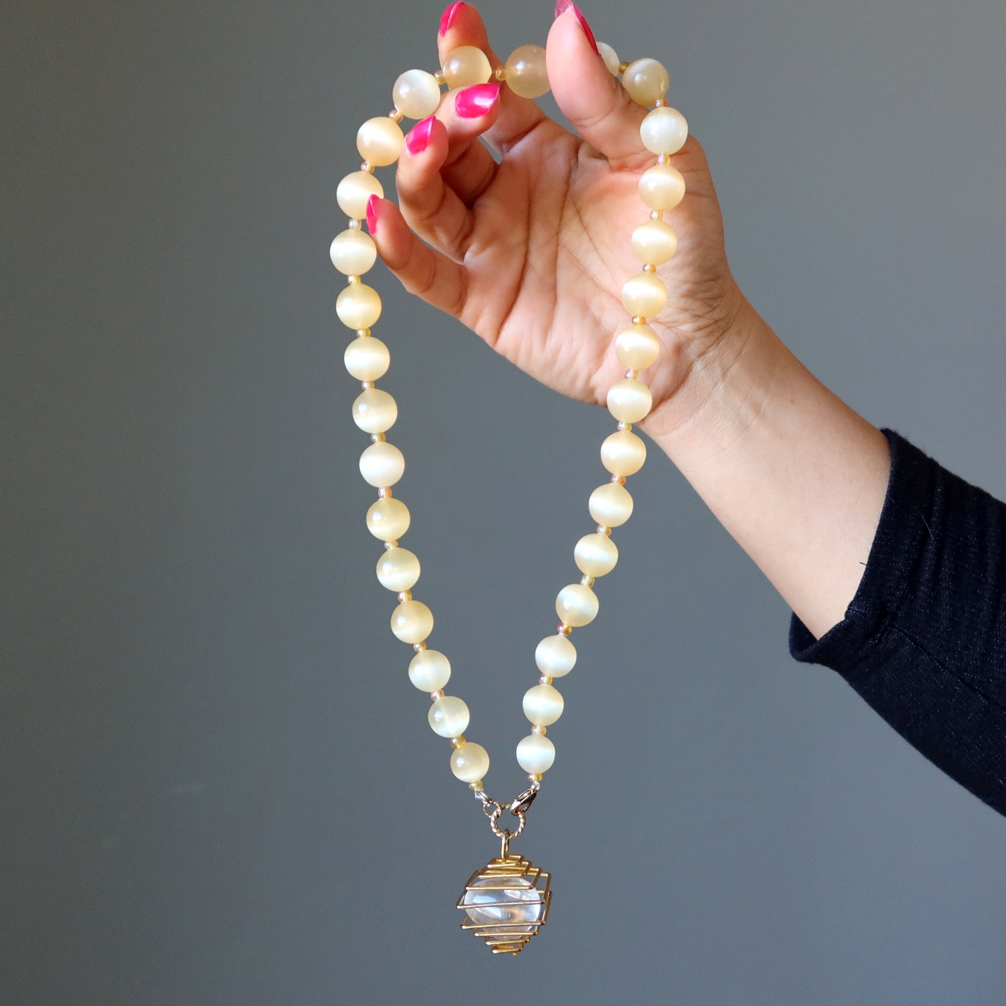 Selenite Necklace Warm Orange Beads with Caged Quartz