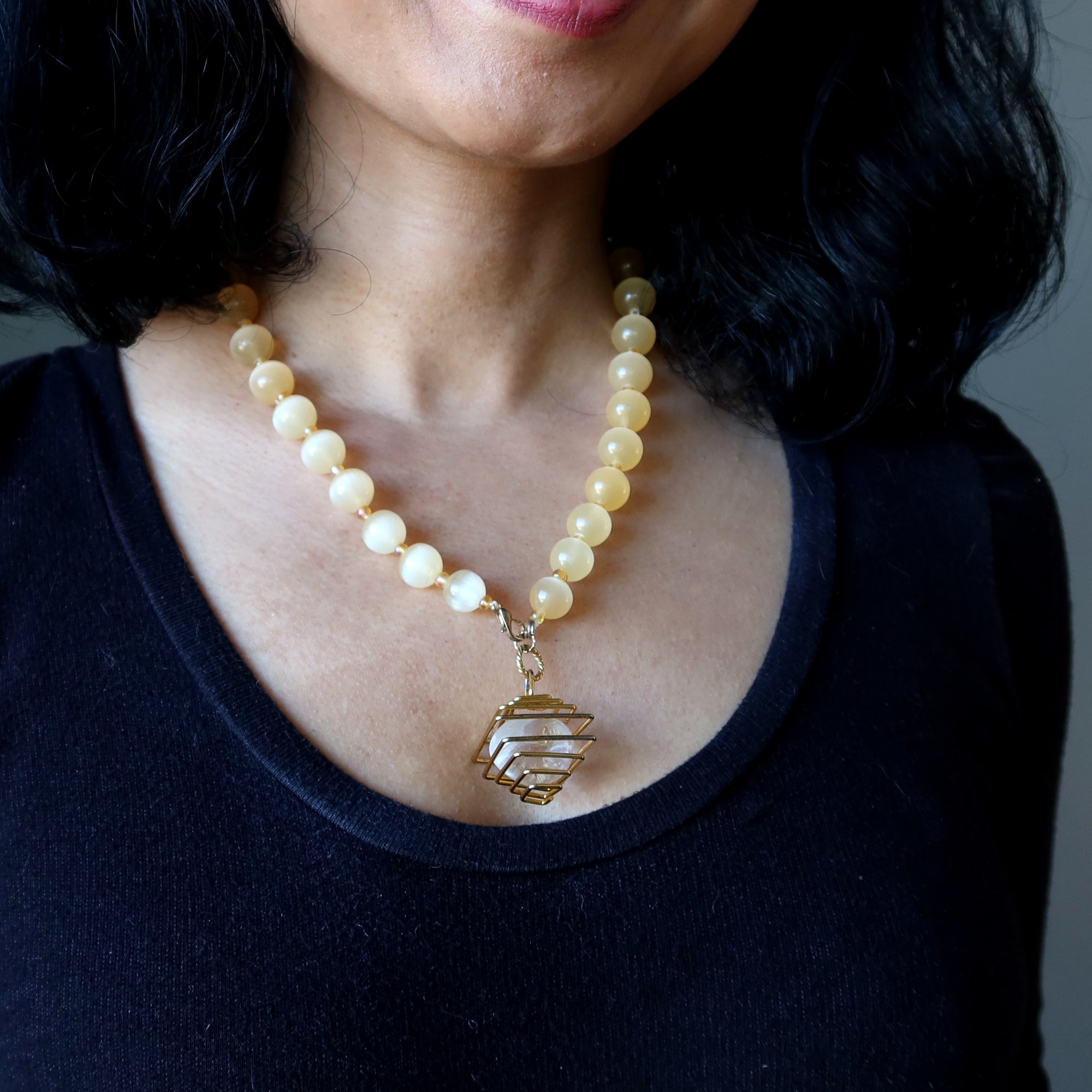 Selenite Necklace Warm Orange Beads with Caged Quartz