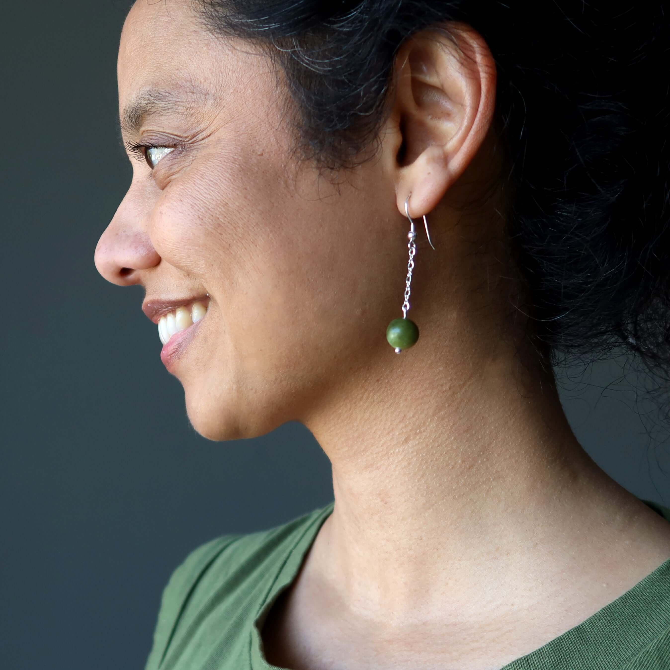 Woman wearing Serpentine green gemstone sterling silver chain earring, Serpentine Earrings Beyond Time Green Sterling