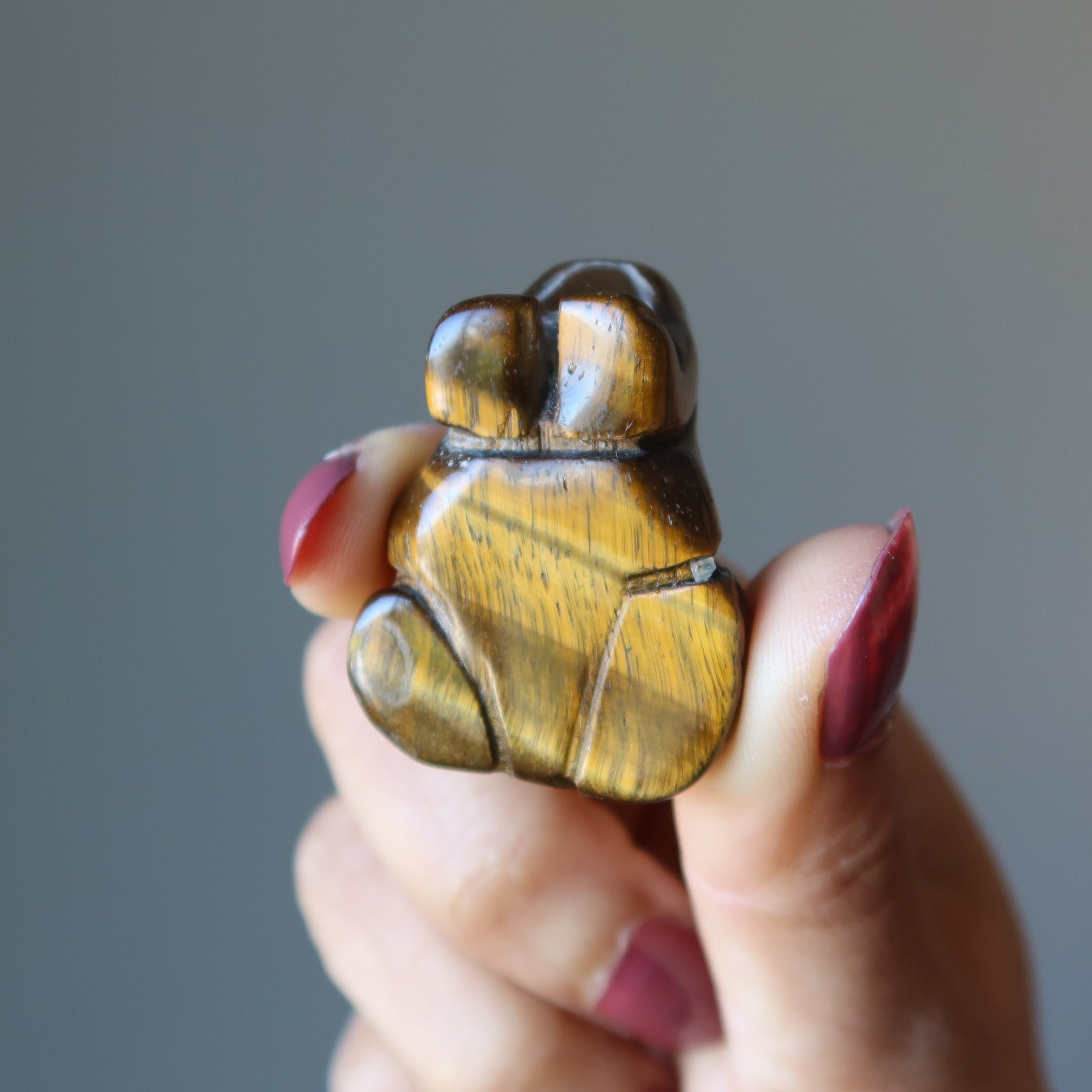 Figurine Grenouille œil de tigre : du rebond à l'éclat